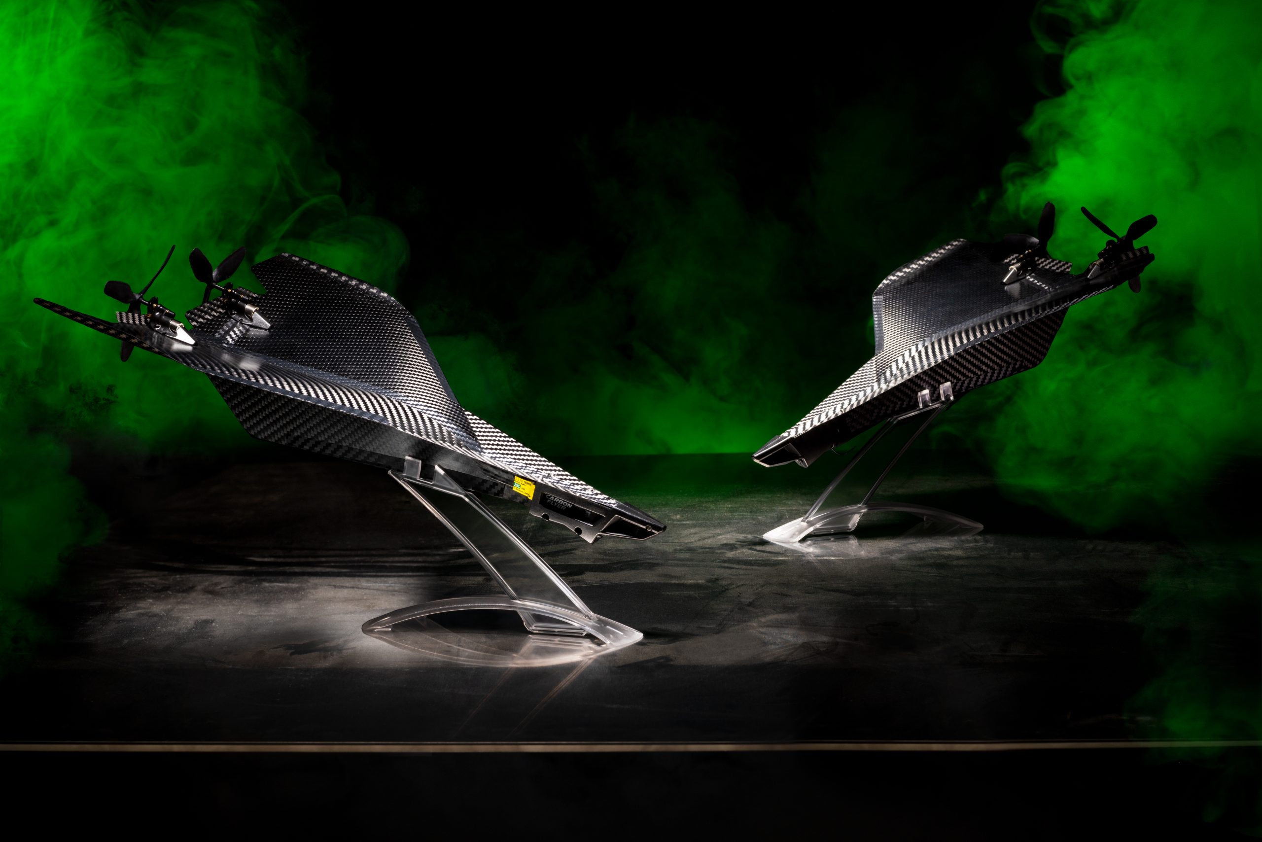 Two remote controlled Carbon Flyer planes with green smoke designed by Trident invents and photographed by UA Creative Studios