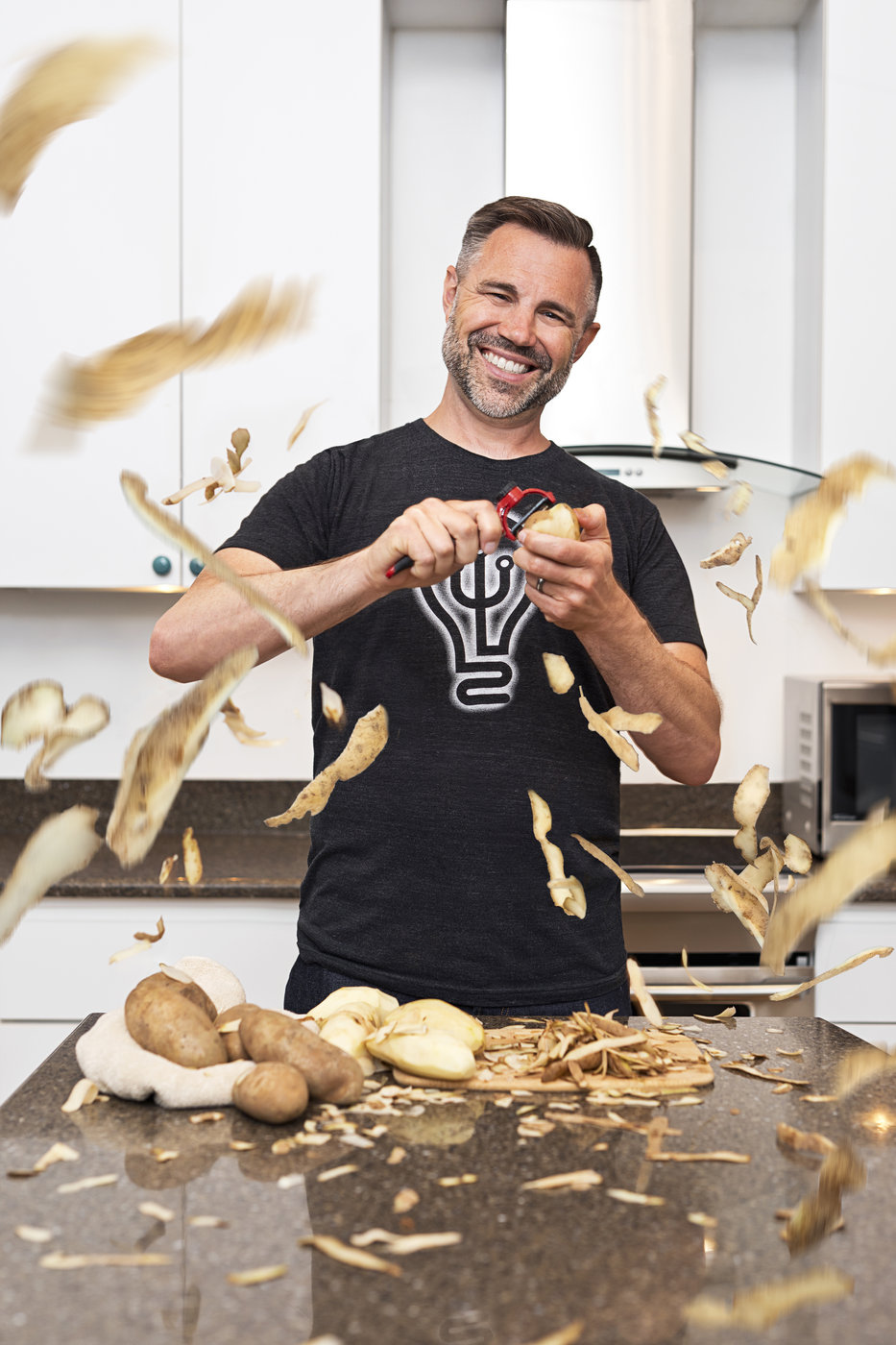 Chris Hawker, owner of Trident Invents, demonstrates how to peel potatoes with his perfect potato peeler invention